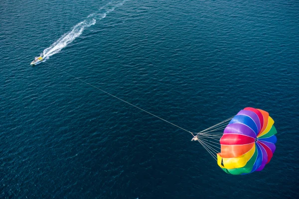 Aerial view of the boat and parachute in the sea resort