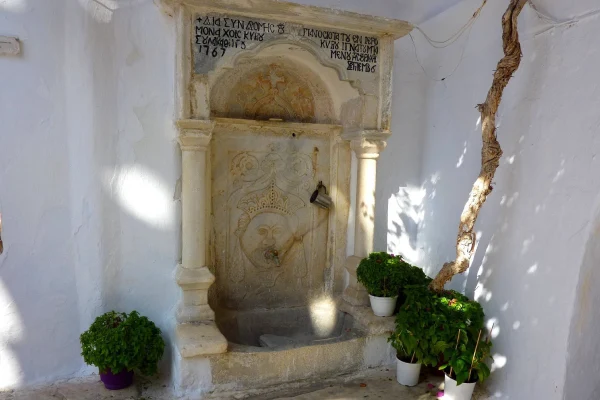 Water fountain in The front of Panagia Tourliani Mykonos