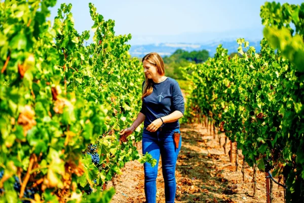 lady in grape yard